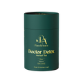Green cylindrical container of PanchAura Doctor Detox Herbal Tea on a white background